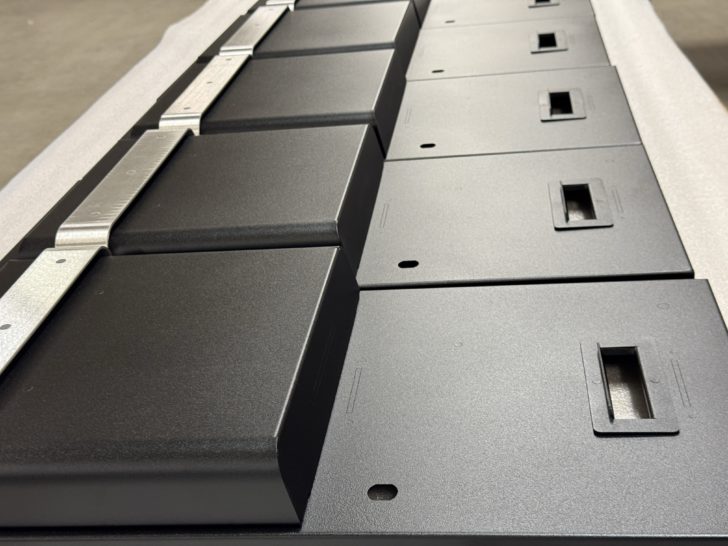 Custom Metal Enclosures fabricated and powder coated black for the retail kiosk industry by DAWSON